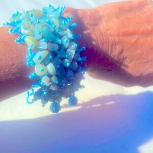 Cute bracelet! Aqua colored stones in a light blue elasticized & beaded band.